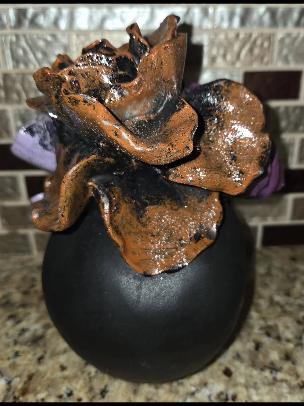Black Resin Decorative Halloween Skull with Purple Lavender & Orange Flowers